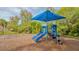 Bright, colorful playground with a slide and covered area, ideal for playtime and activities at 766 Shadow Bay Way, Osprey, FL 34229