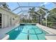 Refreshing pool with spa, enclosed in a screened lanai for year-round enjoyment at 766 Shadow Bay Way, Osprey, FL 34229