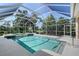 Beautiful pool and spa area surrounded by a screened enclosure, ensuring privacy at 766 Shadow Bay Way, Osprey, FL 34229