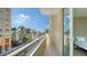 Balcony with views of downtown, palm trees and water fountain at 800 N Tamiami Trl # 317, Sarasota, FL 34236