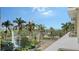Balcony view of palms, water fountain and downtown at 800 N Tamiami Trl # 317, Sarasota, FL 34236