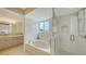 Luxurious bathroom featuring a soaking tub, walk-in shower, and modern fixtures, creating a spa-like retreat at 800 N Tamiami Trl # 317, Sarasota, FL 34236