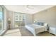 Bright bedroom featuring a comfortable bed, modern furnishings, and a window with plenty of natural light at 800 N Tamiami Trl # 317, Sarasota, FL 34236