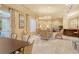 Elegant lounge area with comfortable seating, chandelier lighting, and stylish decor at 800 N Tamiami Trl # 317, Sarasota, FL 34236