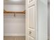 Bright, open walk-in closet features custom wood shelving and wood floor at 800 N Tamiami Trl # 317, Sarasota, FL 34236
