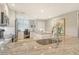 Open-concept kitchen with granite countertops, stainless steel appliances, and a work area with built-in desk at 8735 Olde Hickory Ave # 8205, Sarasota, FL 34238