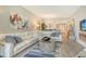 Modern living room featuring a sectional sofa, contemporary decor, and an open floor plan at 8735 Olde Hickory Ave # 8205, Sarasota, FL 34238