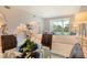 Inviting living room with sleek furnishings and a view of the beautifully manicured backyard at 8735 Olde Hickory Ave # 8205, Sarasota, FL 34238