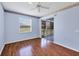 Spacious bedroom featuring hardwood floors and access to a screened-in patio at 8755 Olde Hickory Ave # 7105, Sarasota, FL 34238