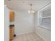 Bright kitchen nook with window and chandelier at 8755 Olde Hickory Ave # 7105, Sarasota, FL 34238