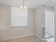 Cozy kitchen nook area featuring a large window at 8755 Olde Hickory Ave # 7105, Sarasota, FL 34238