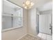 Bright kitchen nook featuring a large window and adjacent entry door at 8755 Olde Hickory Ave # 7105, Sarasota, FL 34238