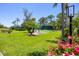 Well-maintained tennis court surrounded by lush greenery, offering a great space for an active lifestyle at 8755 Olde Hickory Ave # 7105, Sarasota, FL 34238