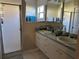 Bathroom featuring double sinks, generous countertop space, and glass enclosed walk-in shower at 10116 Reagan Dairy Trl, Bradenton, FL 34212