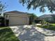 Charming single-story home with a two-car garage, well-manicured landscaping, and inviting curb appeal at 10116 Reagan Dairy Trl, Bradenton, FL 34212