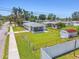 Aerial view of the home's backyard, complete with a screened porch, storage shed, and fenced perimeter at 1200 25Th W Ave, Palmetto, FL 34221
