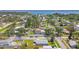 Wide aerial view of a residential neighborhood featuring a home with a metal shed and surrounding properties near the water at 1200 25Th W Ave, Palmetto, FL 34221