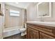 This bathroom features a shower and tub, a vanity, and dark wood floors at 1200 25Th W Ave, Palmetto, FL 34221