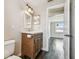 This bathroom features a vanity, a toilet, and is located next to a bedroom at 1200 25Th W Ave, Palmetto, FL 34221