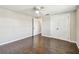 This bedroom features wood floors, a ceiling fan, and a closet with bi-fold doors at 1200 25Th W Ave, Palmetto, FL 34221