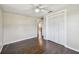 This bedroom features wood floors, ceiling fan, and a closet with bi-fold doors at 1200 25Th W Ave, Palmetto, FL 34221