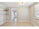 The dining room features tile floors, a doorway to another room, and built-in shelves at 1200 25Th W Ave, Palmetto, FL 34221