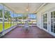 Enjoy the outdoors on this screened patio with outdoor furniture and views of the backyard at 1200 25Th W Ave, Palmetto, FL 34221