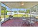 Enjoy the outdoors on this screened patio with outdoor furniture and views of the backyard at 1200 25Th W Ave, Palmetto, FL 34221