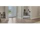 Bright hallway with views of the front yard and a glimpse into the adjacent room at 12005 Trails Reserve Ct, Sarasota, FL 34238