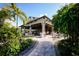Relax at the outdoor bar in a tropical setting with lush landscaping and comfortable seating at 12005 Trails Reserve Ct, Sarasota, FL 34238