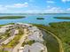 Scenic aerial view of waterfront condos with lush landscaping and ocean views in a beautiful coastal community at 1312 Perico Point Cir, Bradenton, FL 34209