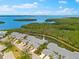 An aerial view of townhomes, water views, and lush foliage at 1312 Perico Point Cir, Bradenton, FL 34209
