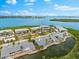 Beautiful aerial view of waterfront condominiums nestled amongst a well-manicured landscape at 1312 Perico Point Cir, Bradenton, FL 34209