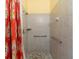 Walk-in shower with tile surround and safety bars in a bathroom at 1312 Perico Point Cir, Bradenton, FL 34209