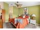 Bedroom with an ensuite doorway, carpet, and light green walls at 1312 Perico Point Cir, Bradenton, FL 34209