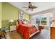 A cozy bedroom with a large window, shutters, and stylish decorations at 1312 Perico Point Cir, Bradenton, FL 34209