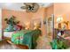 Bedroom with a fan, closet, side table and view of the hallway at 1312 Perico Point Cir, Bradenton, FL 34209