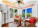 Bright breakfast nook with plantation shutters and charming accents at 1312 Perico Point Cir, Bradenton, FL 34209