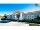 Charming clubhouse featuring a welcoming entrance with columns, ample parking, and manicured landscaping at 1312 Perico Point Cir, Bradenton, FL 34209