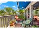 Cozy shaded deck with water view, lounge chair, and outdoor seating with potted plants at 1312 Perico Point Cir, Bradenton, FL 34209