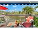A charming deck with potted plants and comfortable lounge seating overlooking the water at 1312 Perico Point Cir, Bradenton, FL 34209