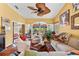 Bright living room with hardwood floors and comfortable seating areas at 1312 Perico Point Cir, Bradenton, FL 34209