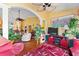 Open concept living room featuring wood floors, stylish decor, and lots of natural light at 1312 Perico Point Cir, Bradenton, FL 34209