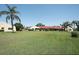 Expansive green space between the townhomes, beautifully landscaped with mature trees and lush lawns at 1314 57Th W St # 1314, Bradenton, FL 34209