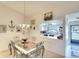 Dining room with chandelier and passthrough to the kitchen at 1314 57Th W St # 1314, Bradenton, FL 34209