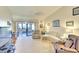 Cozy living room featuring comfortable seating and view to outdoor patio at 1314 57Th W St # 1314, Bradenton, FL 34209