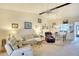 Open-concept living room connected to the dining room with kitchen access at 1314 57Th W St # 1314, Bradenton, FL 34209