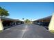 Wide shot showing the covered parking area with ample parking spots available for residents and guests at 1314 57Th W St # 1314, Bradenton, FL 34209