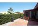 Charming patio featuring a grill, beautiful landscaping, and inviting outdoor space at 1314 57Th W St # 1314, Bradenton, FL 34209