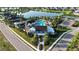 Aerial view showcasing the community pool, amenities, and surrounding neighborhood at 13708 Old Creek Ct, Parrish, FL 34219
